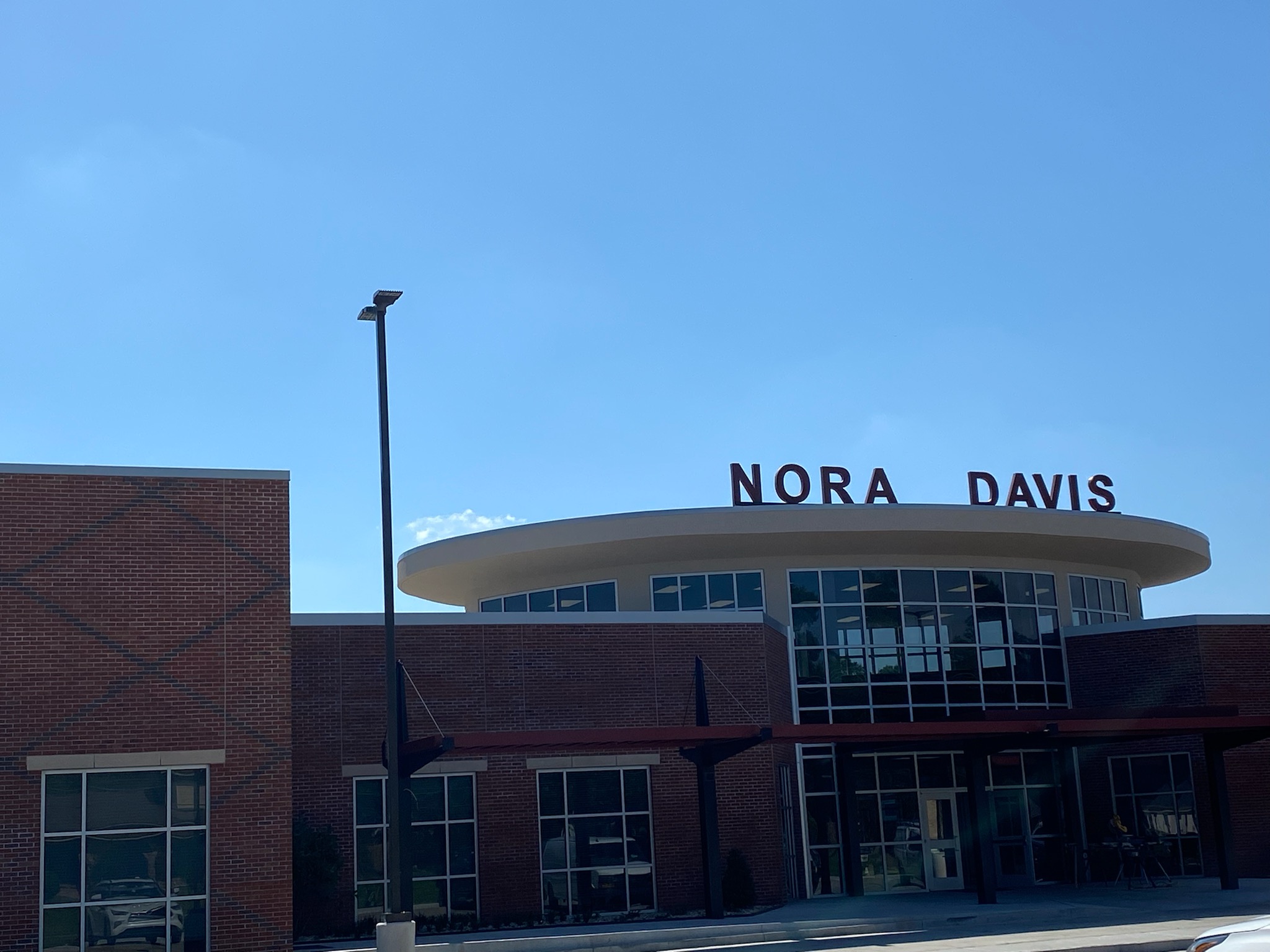 Picture of school with letters on the roof that spell NORA DAVIS